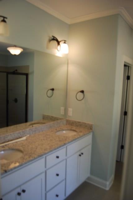 10 Laurel Ridge Forsyth, GA 31029 - Photo 15 of 23 a bathroom with a granite countertop sink and mirror