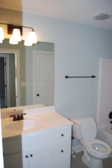 10 Laurel Ridge Forsyth, GA 31029 - Photo 19 of 23 a bathroom with a sink a toilet and a mirror