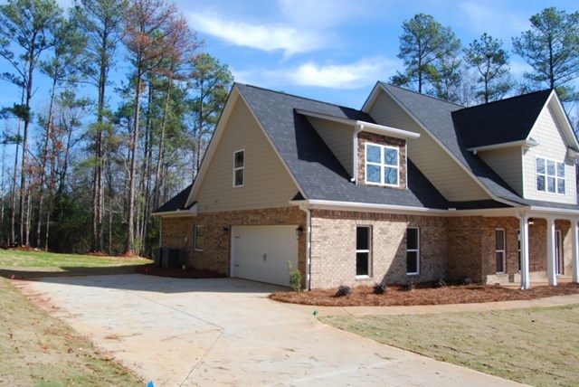 10 Laurel Ridge Forsyth, GA 31029 - Photo 22 of 23 a front view of a house with a yard and garage