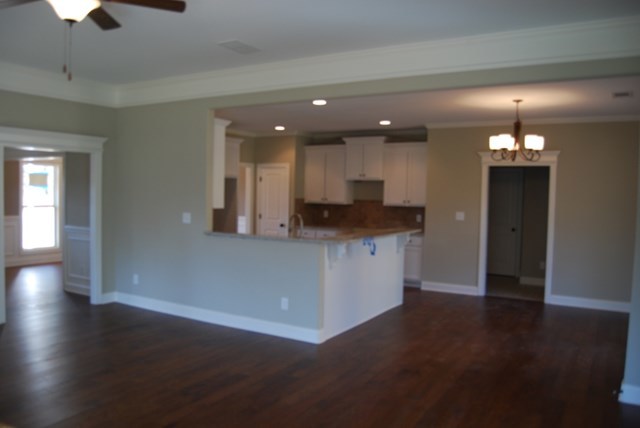 10 Laurel Ridge Forsyth, GA 31029 - Photo 5 of 23 wooden floor in an empty room with a kitchen