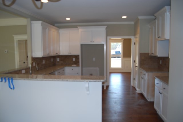 10 Laurel Ridge Forsyth, GA 31029 - Photo 6 of 23 a kitchen with stainless steel appliances granite countertop a refrigerator a sink dishwasher a stove and white countertops with wooden floor