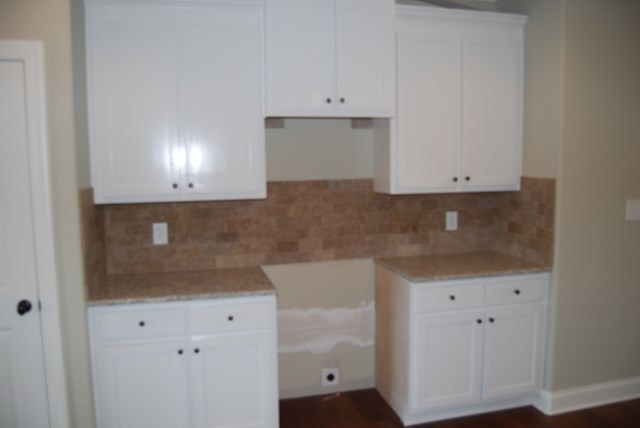 10 Laurel Ridge Forsyth, GA 31029 - Photo 8 of 23 a view of kitchen with granite countertop white cabinets and a sink