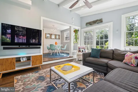 a view of a backyard with a patio and outdoor seating