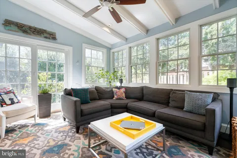 a backyard of a house with barbeque oven table and chairs