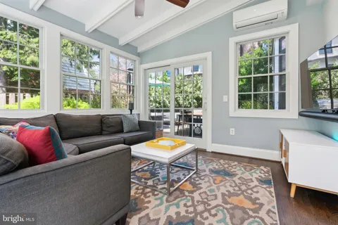 a view of a patio with a table and chairs under an umbrella