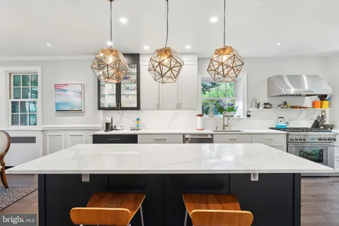 a kitchen with a stove and a refrigerator
