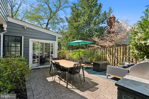 a spacious bedroom with a bed a couch and a window