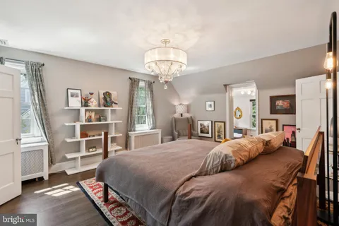 a view of an entryway with wooden floor