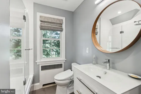 a view of walk in closet with racks on the wall
