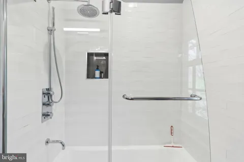 a view of room with a sink and a mirror