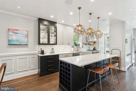 a living room with furniture a fireplace and a window