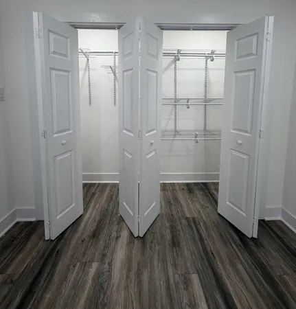 a view of a bathroom with wooden floor