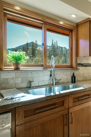 a kitchen sink sitting next to a window