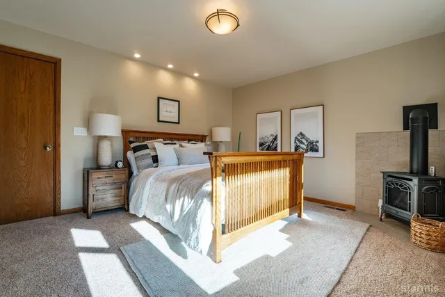 a bedroom with a bed and a television