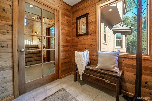 a view of a two chair in the room and a window