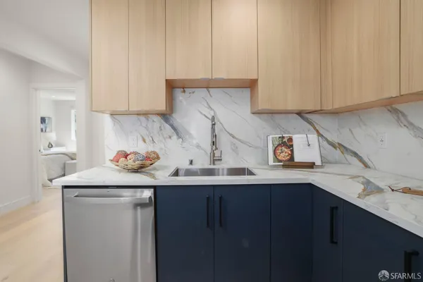 a kitchen with a sink and cabinets