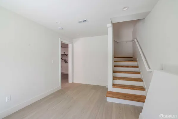 a view of entryway with wooden floor