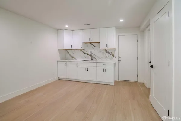 a view of kitchen with wooden floor