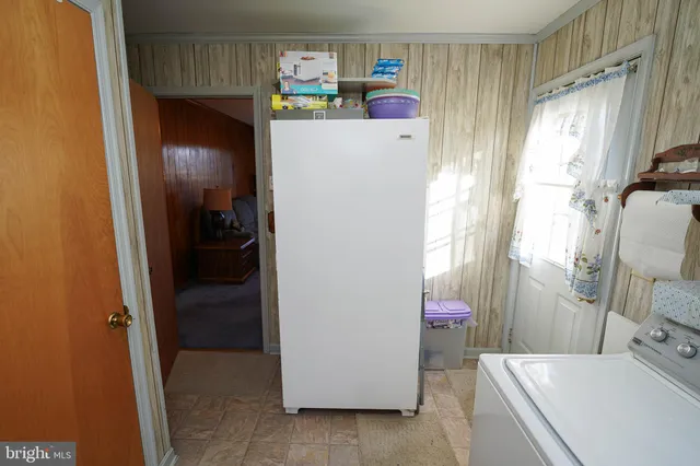 a bedroom with a bed and a mirror