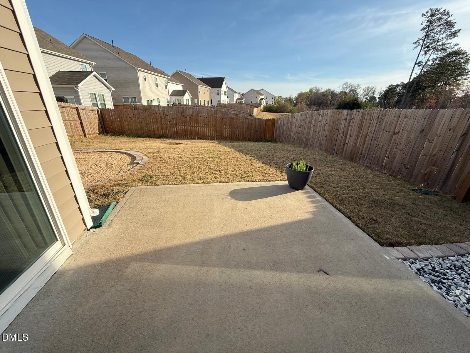 64 Nailsworth Street Angier, NC 27501 - Photo 13 of 14 a view of a back yard of the house
