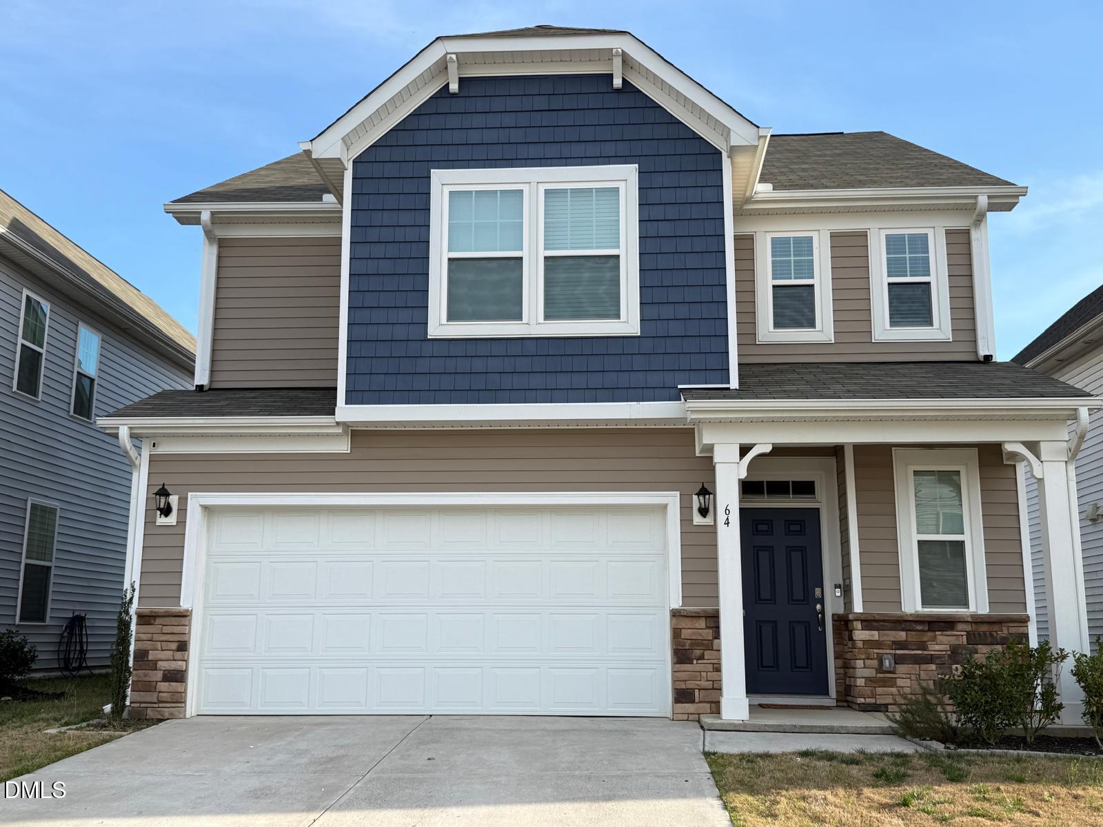 64 Nailsworth Street Angier, NC 27501 - Photo 2 of 14 a front view of a house with a garage