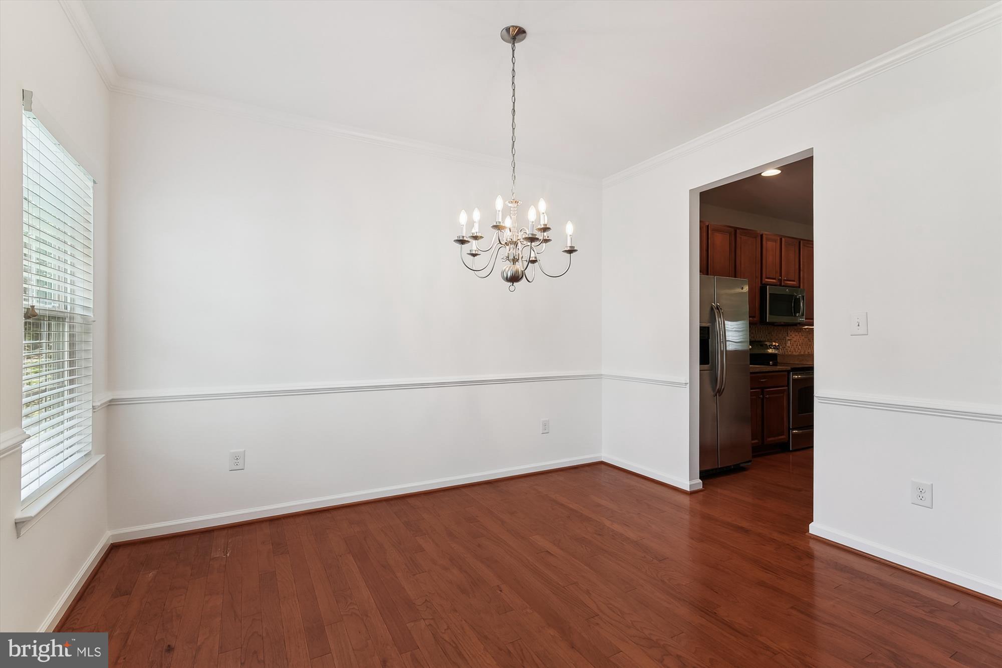36311 Ridgeshore Lane Millville, DE 19967 - Photo 13 of 36 a view of a room with wooden floor and ceiling fan