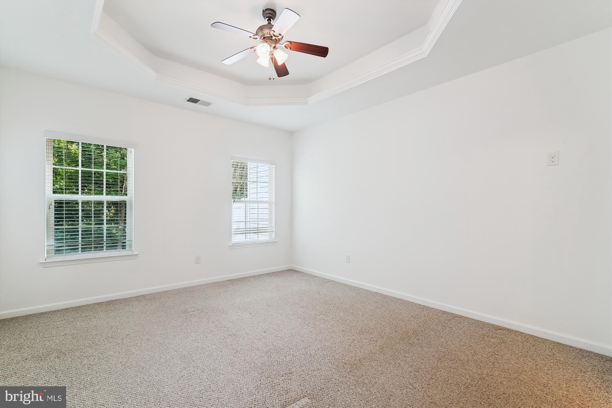 36311 Ridgeshore Lane Millville, DE 19967 - Photo 15 of 36 an empty room with windows and fan