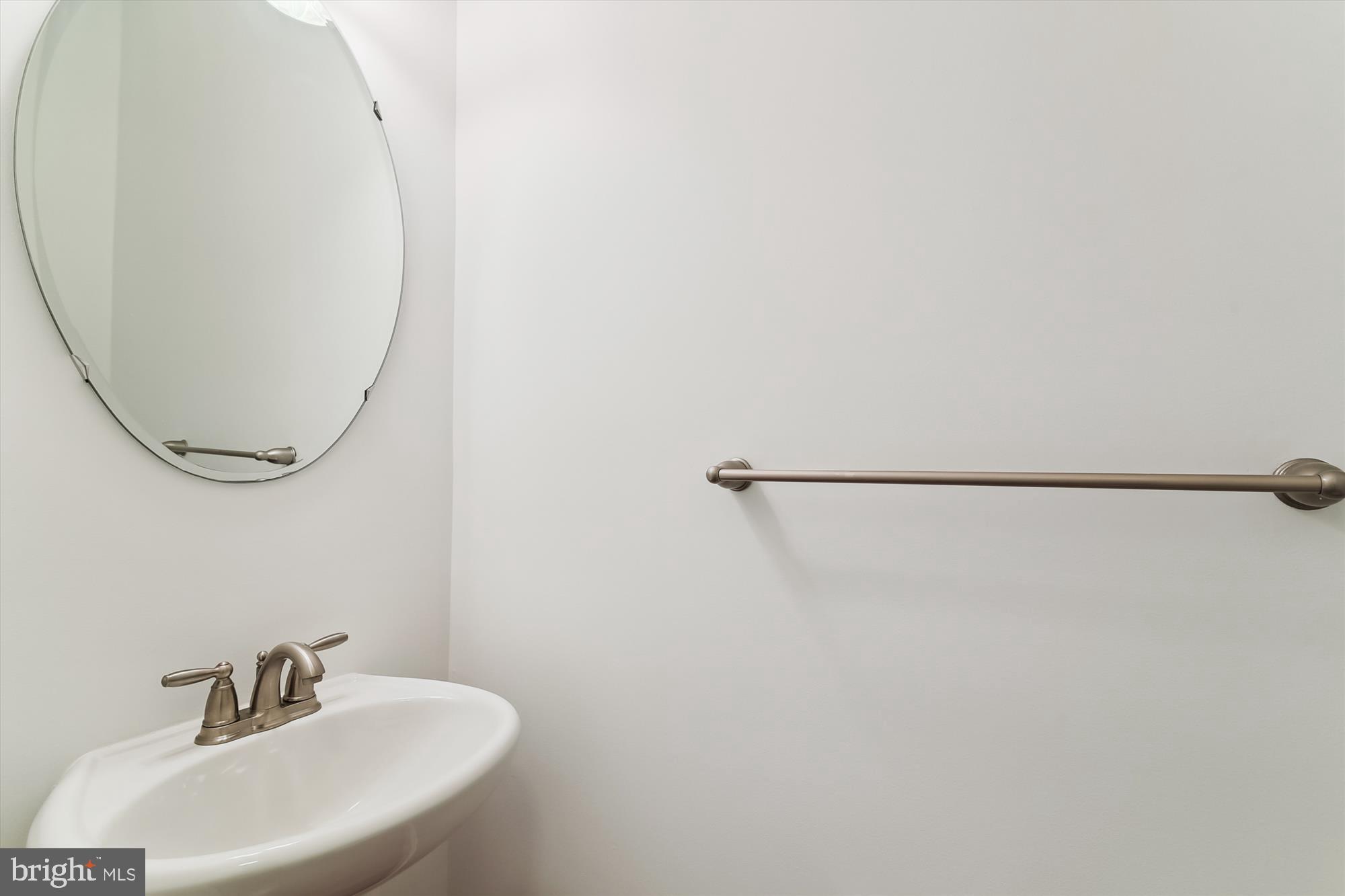 36311 Ridgeshore Lane Millville, DE 19967 - Photo 19 of 36 a bathroom with a sink and a mirror