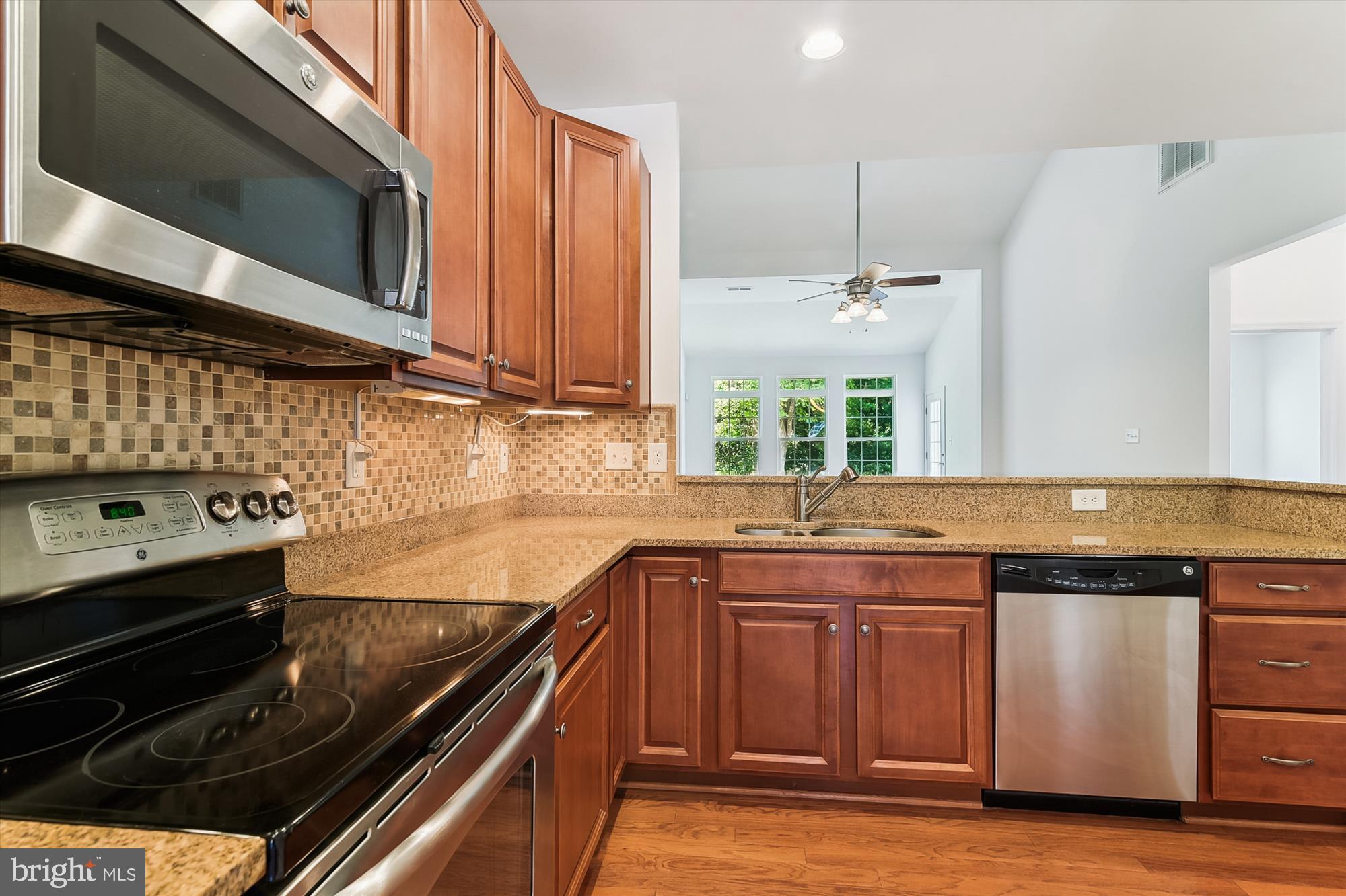 36311 Ridgeshore Lane Millville, DE 19967 - Photo 2 of 36 a kitchen with a sink stove and microwave