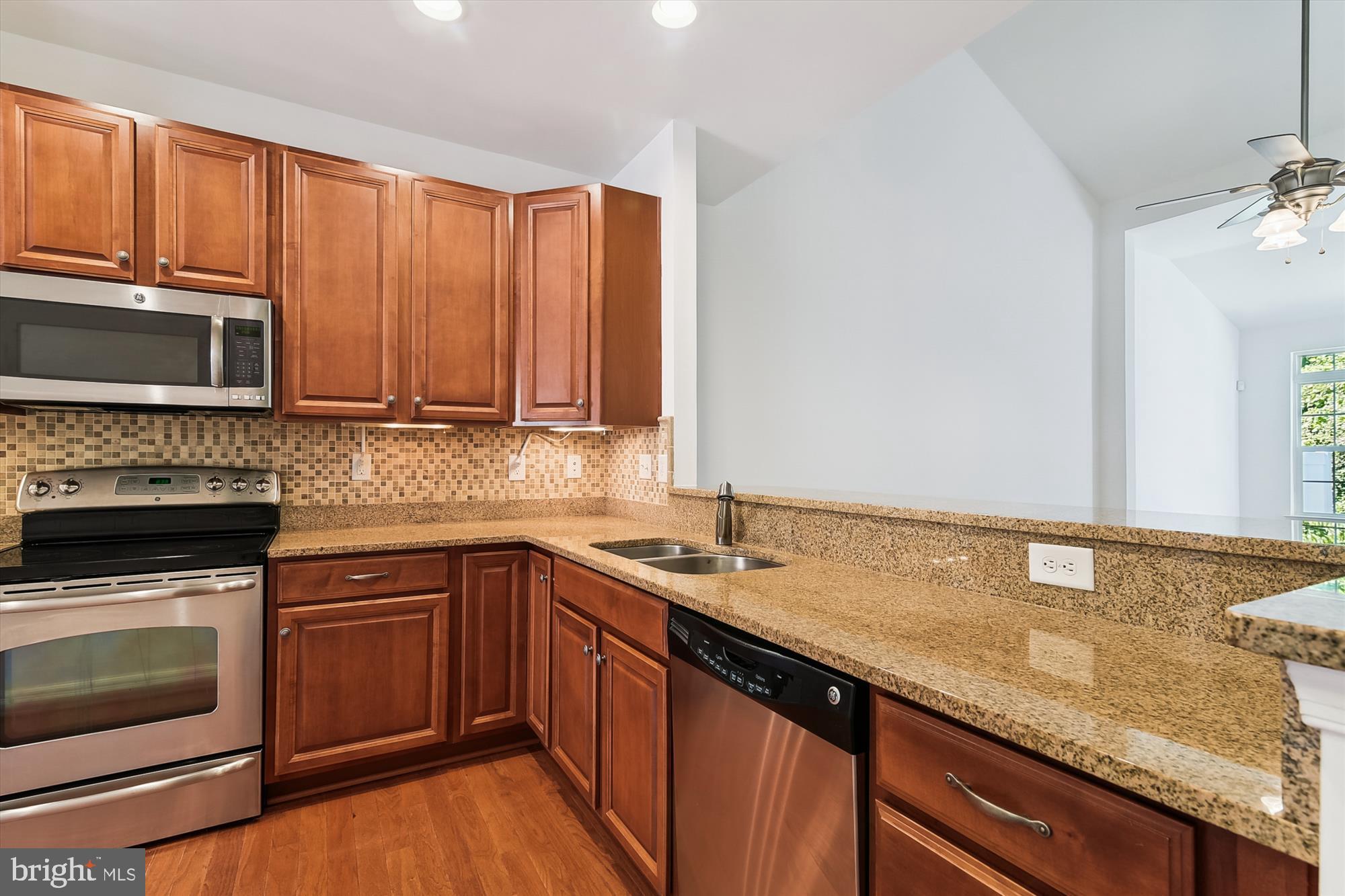 36311 Ridgeshore Lane Millville, DE 19967 - Photo 3 of 36 a kitchen with a sink stove and microwave