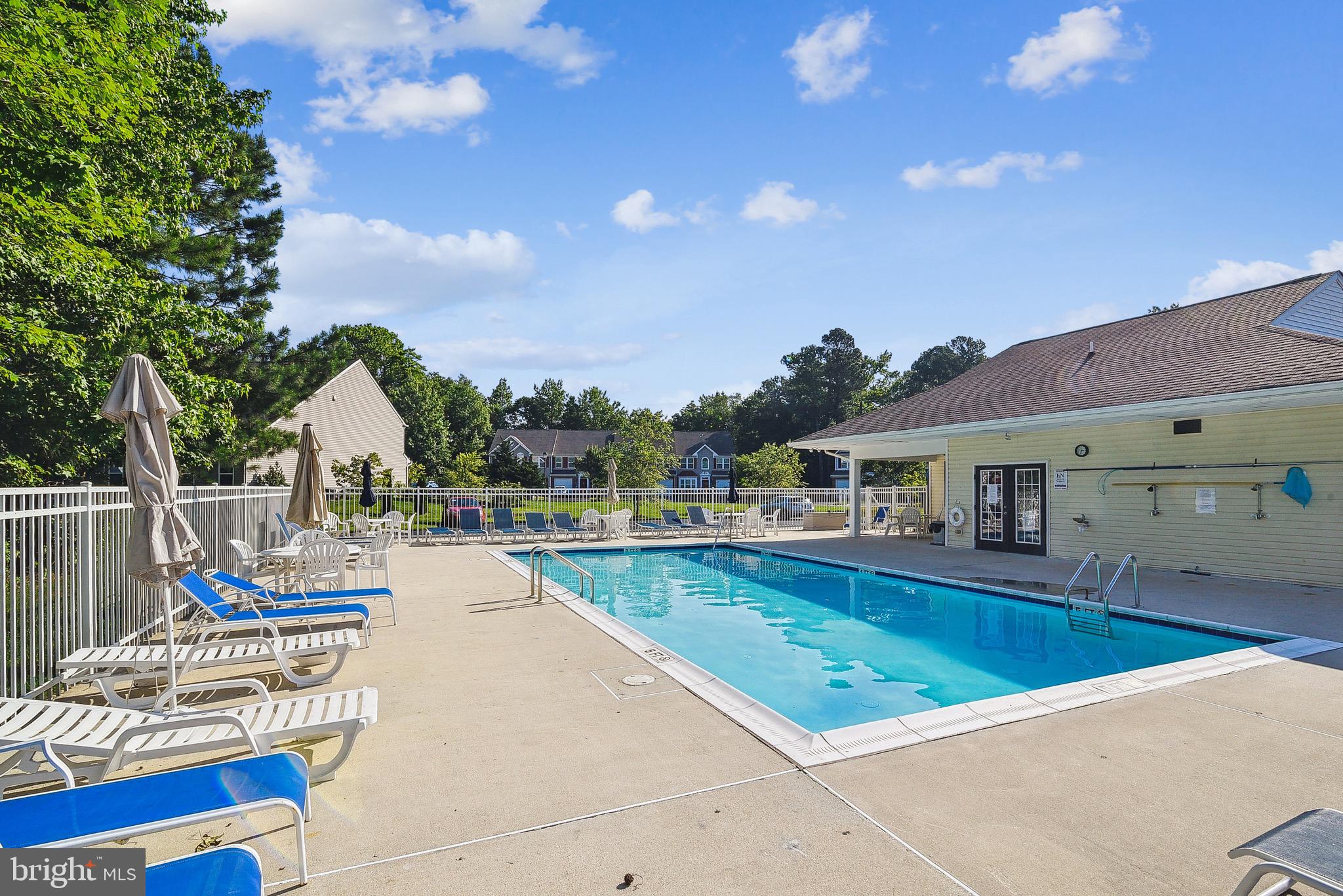 36311 Ridgeshore Lane Millville, DE 19967 - Photo 34 of 36 a view of swimming pool with outdoor seating and a yard