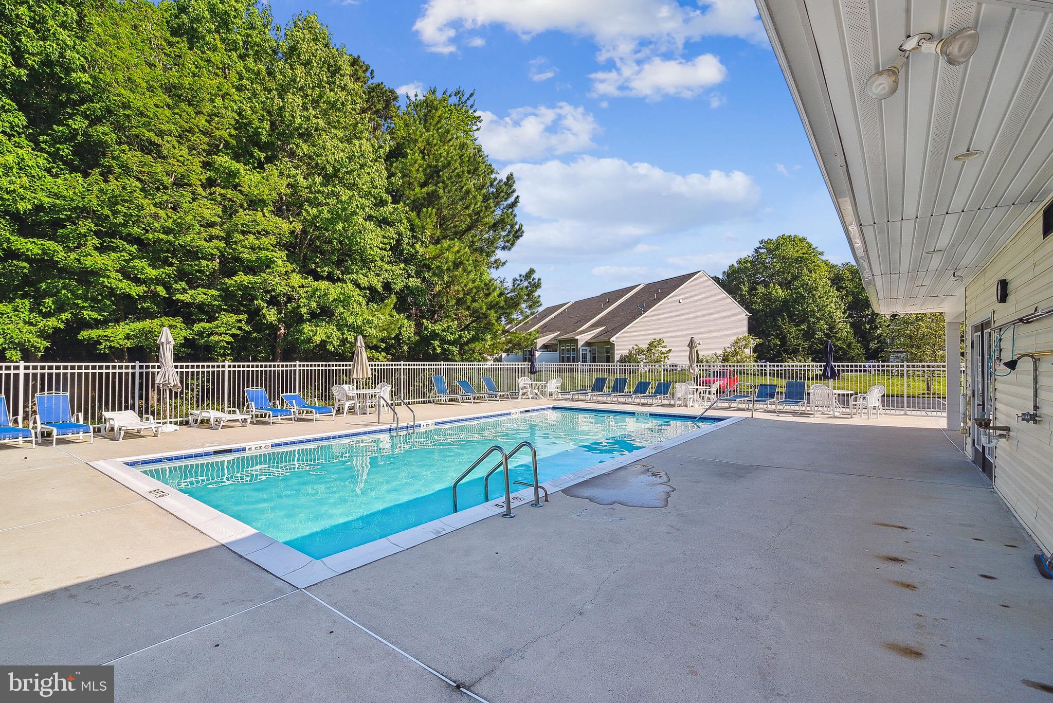 36311 Ridgeshore Lane Millville, DE 19967 - Photo 35 of 36 a view of a backyard with swimming pool