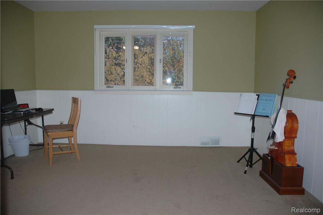 33705 Quaker Valley Road Farmington, MI 48331 - Photo 16 of 27 Bedroom with wainscoting