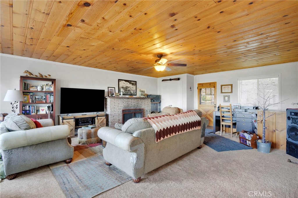 993 Mercury Way Crestline, CA 92325 - Photo 17 of 68 a living room with furniture and a flat screen tv