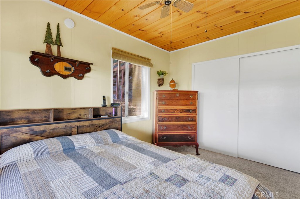993 Mercury Way Crestline, CA 92325 - Photo 36 of 68 a bedroom with a bed and cabinets