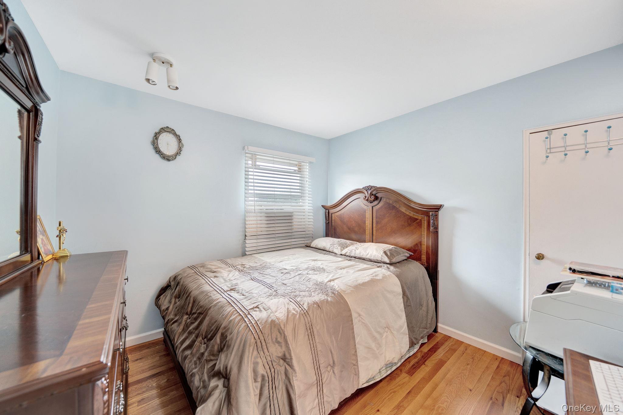 1 Wayland Road Plainview, NY 11803 - Photo 19 of 28 Bedroom with wood finished floors and baseboards