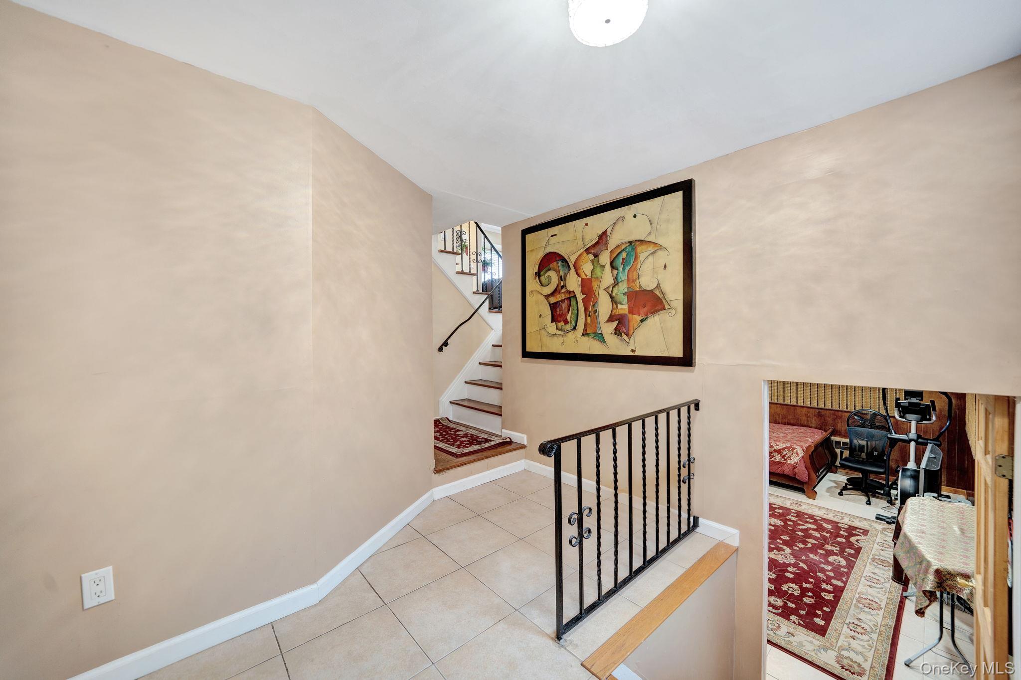 1 Wayland Road Plainview, NY 11803 - Photo 21 of 28 Stairs featuring tile patterned floors and baseboards