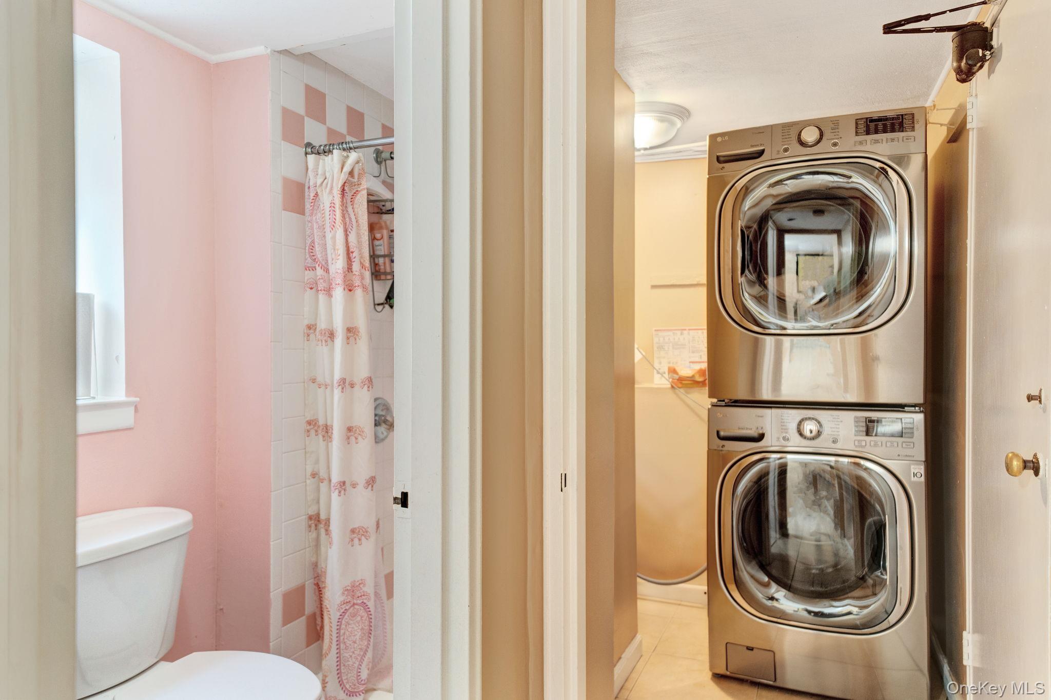 1 Wayland Road Plainview, NY 11803 - Photo 23 of 28 Laundry room with stacked washing machine and dryer