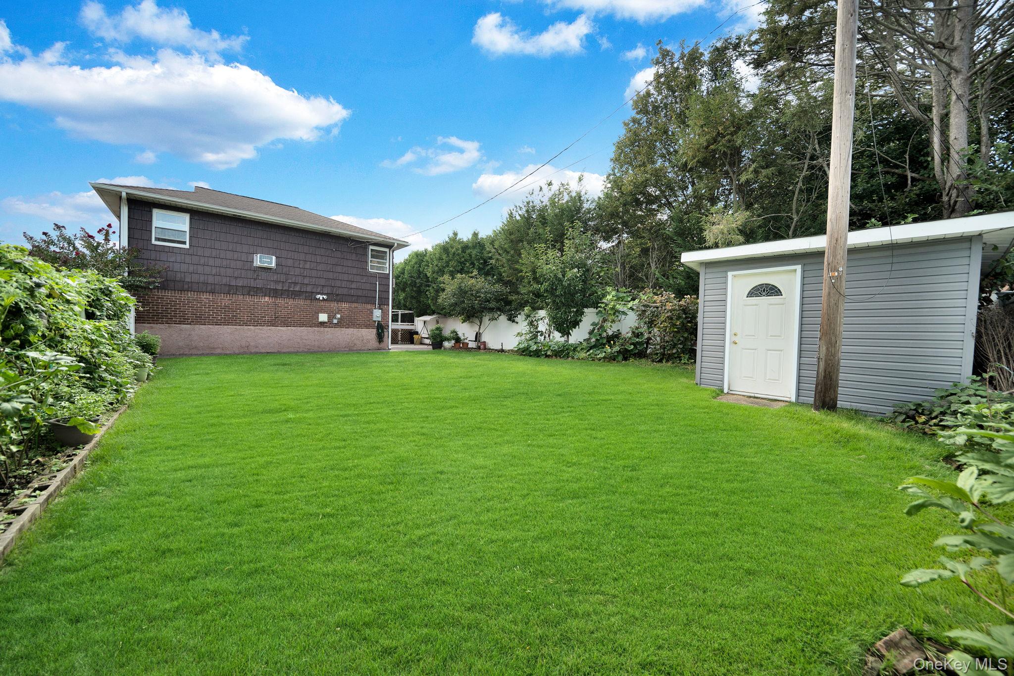 1 Wayland Road Plainview, NY 11803 - Photo 27 of 28 View of yard featuring an outdoor structure