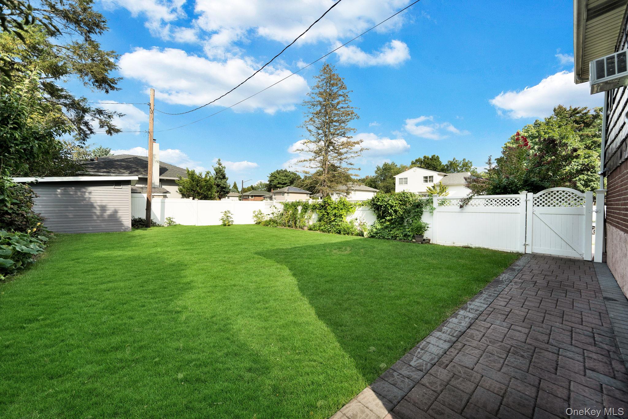 1 Wayland Road Plainview, NY 11803 - Photo 28 of 28 Fenced backyard featuring a gate
