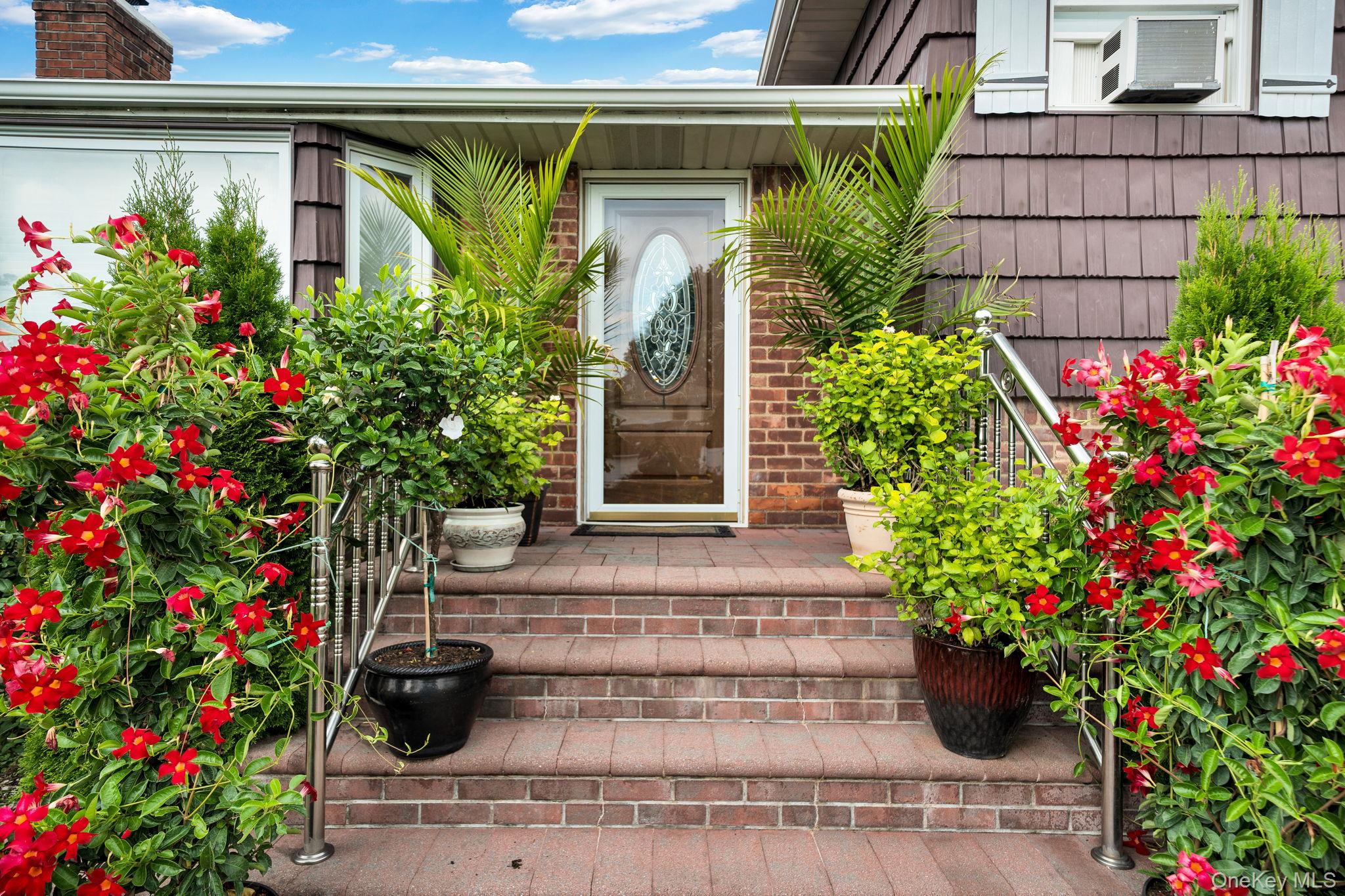 1 Wayland Road Plainview, NY 11803 - Photo 4 of 28 Property entrance featuring a chimney and brick siding