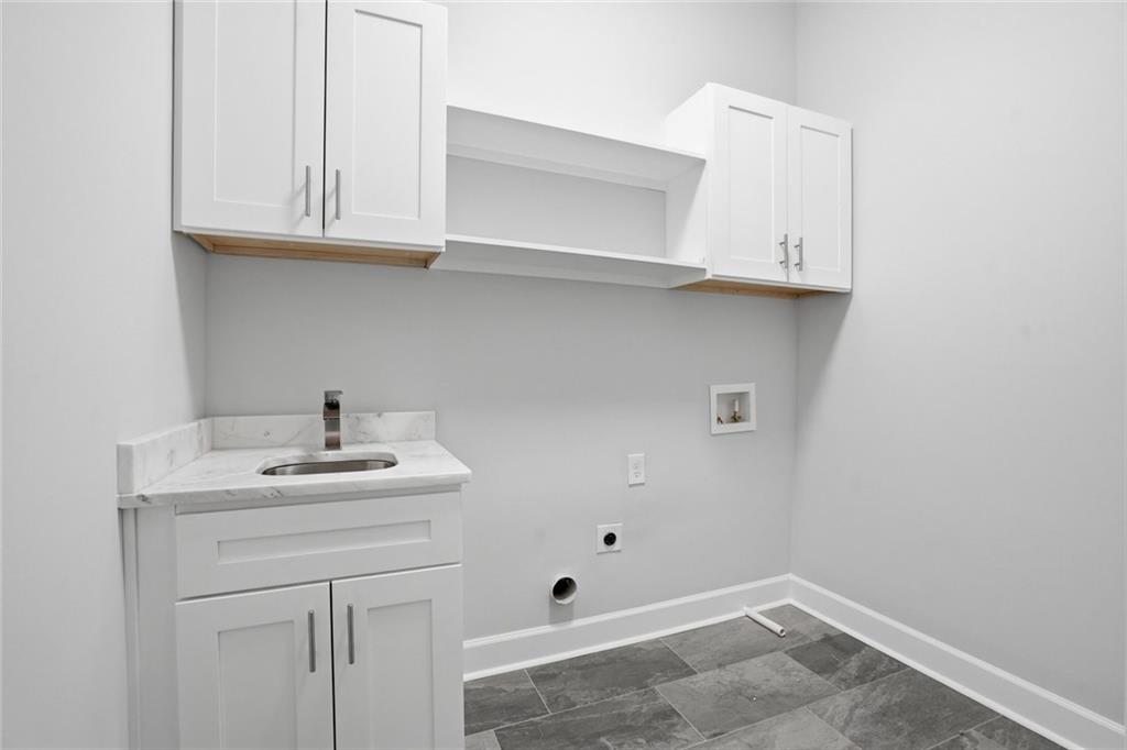 2415 West Rugby Avenue Atlanta, GA 30337 - Photo 36 of 40 a bathroom with a sink