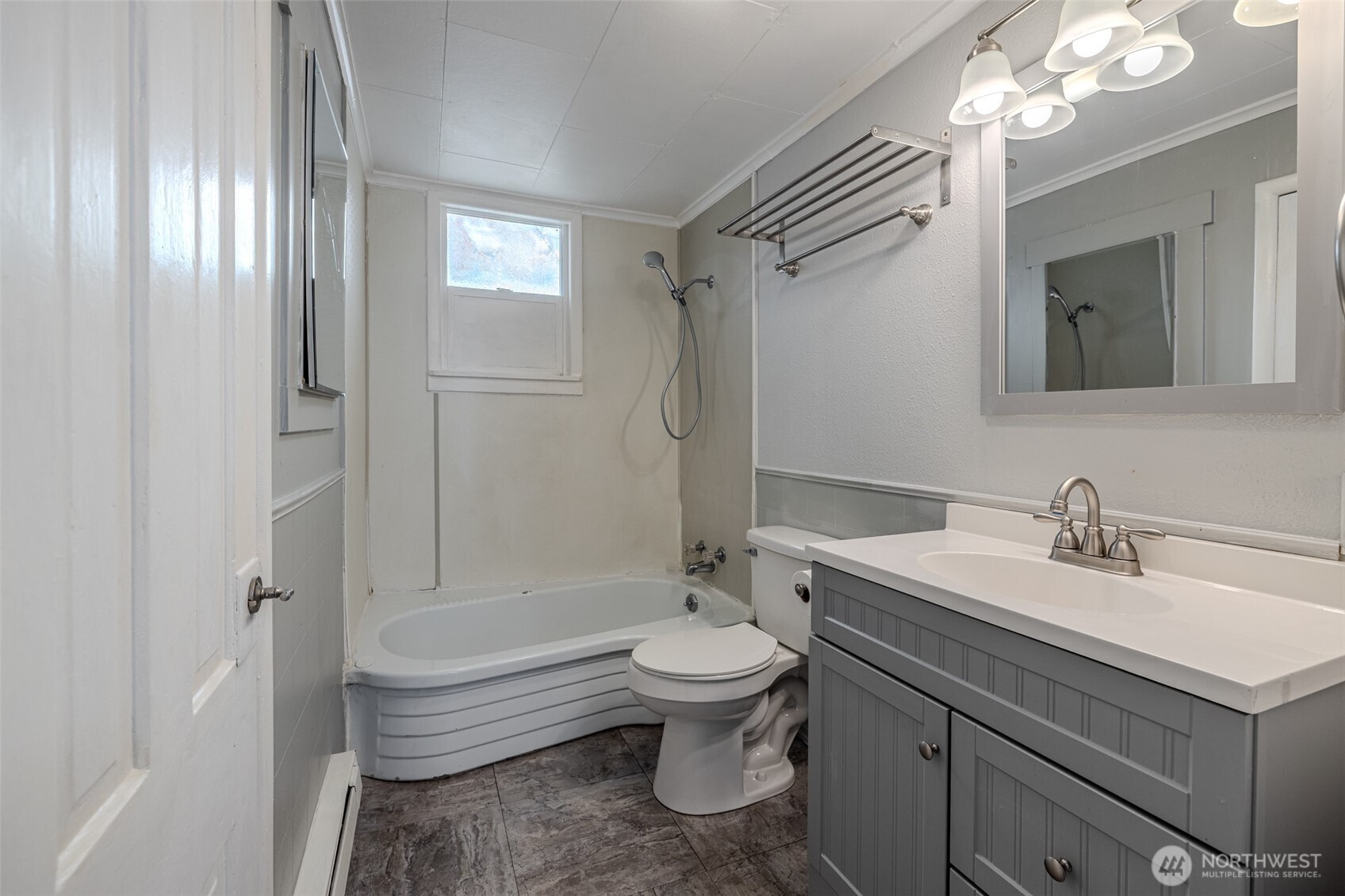 246 North Delaware Avenue Wenatchee, WA 98801 - Photo 12 of 24 a bathroom with a sink a toilet a mirror and shower