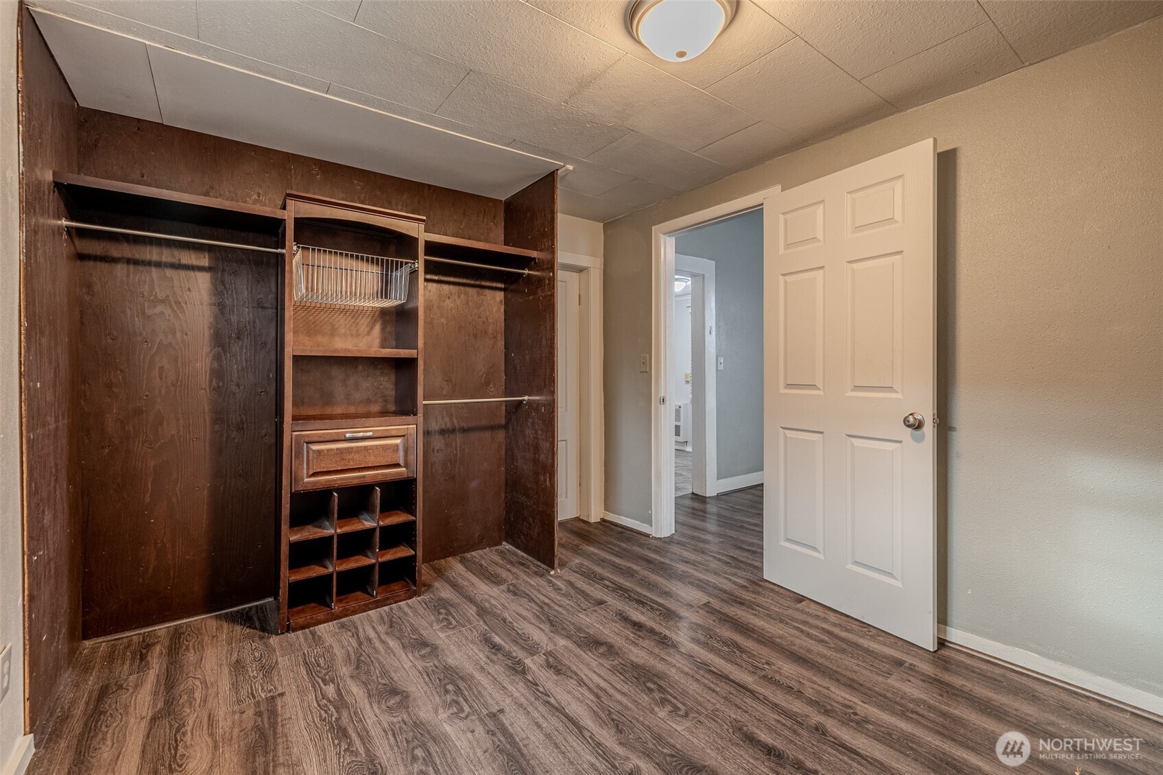 246 North Delaware Avenue Wenatchee, WA 98801 - Photo 19 of 24 a room with walk in closet and wooden floor