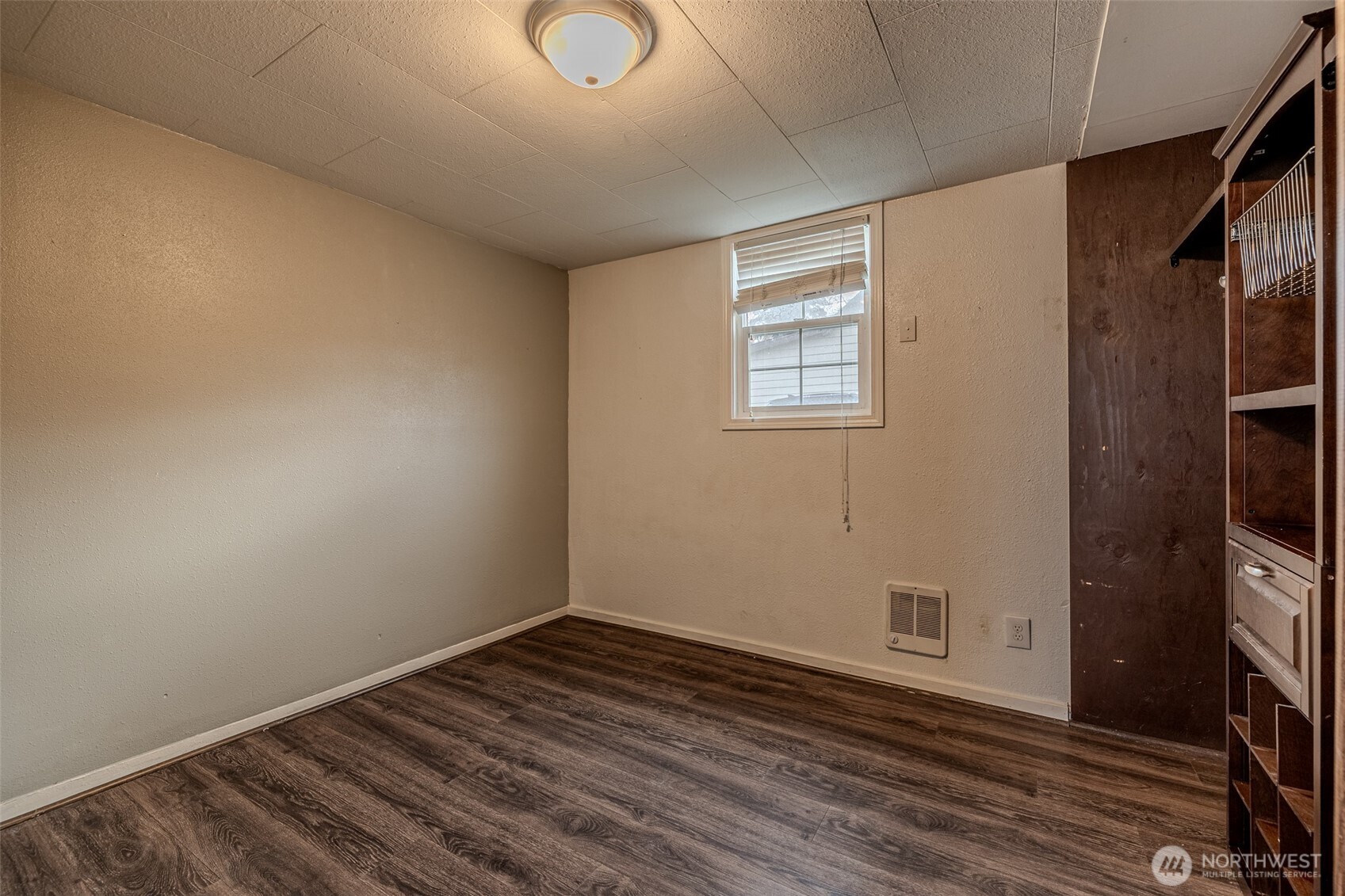 246 North Delaware Avenue Wenatchee, WA 98801 - Photo 20 of 26 a view of an empty room with wooden floor and a window
