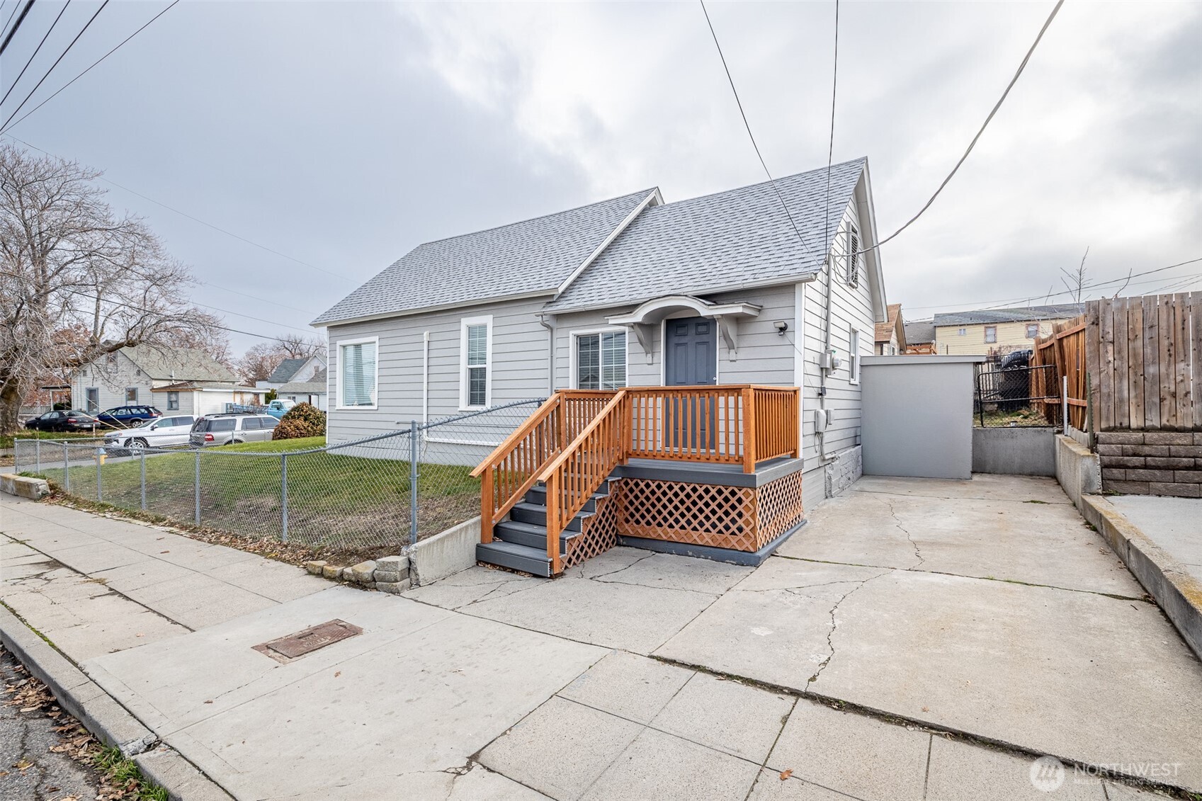 246 North Delaware Avenue Wenatchee, WA 98801 - Photo 3 of 26 a backyard of a house with barbeque oven