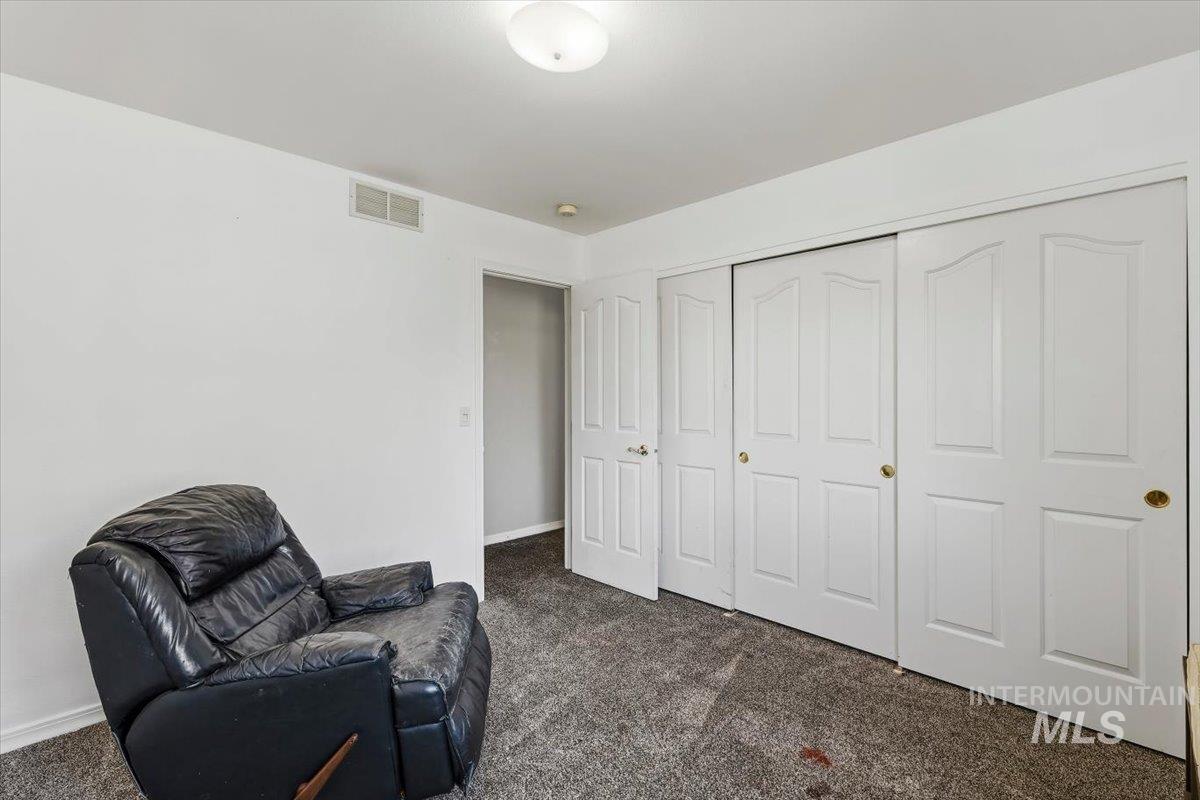 8001 West Innsbrook Court Boise, ID 83704 - Photo 32 of 39 Room with grey carpeted flooring, white walls, and a flush mount ceiling light