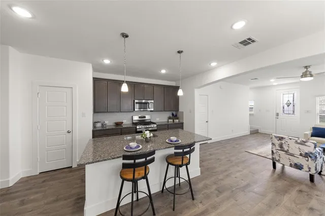 a kitchen with a table and chairs in it