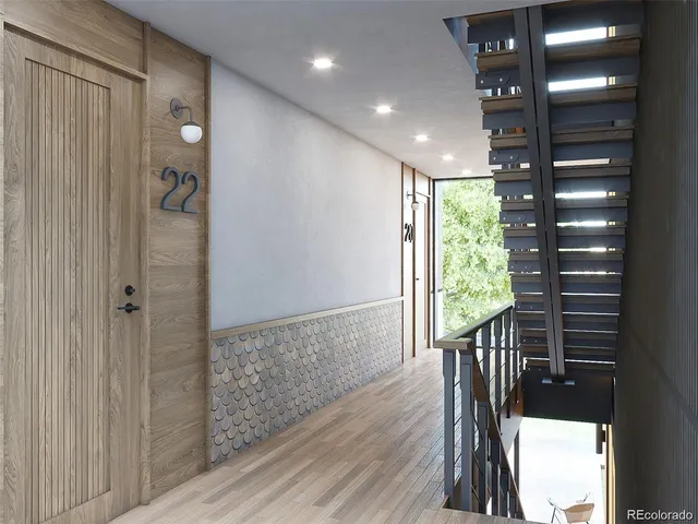 a view of entryway with wooden floor