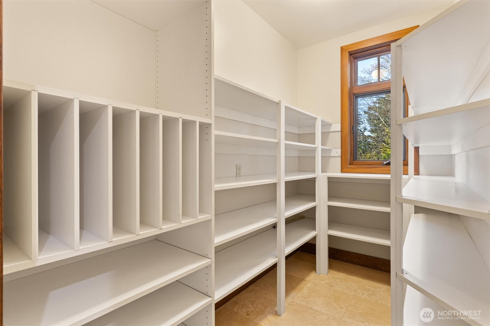 8281 West Mercer Way Mercer Island, WA 98040 - Photo 19 of 38 a view of walk in closet with empty racks